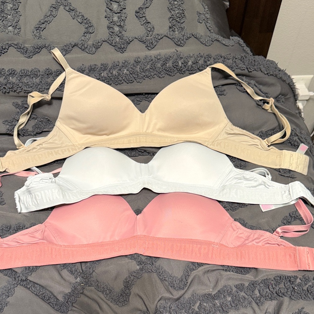 Victoria's Secret Beige, White, and Pink Bras